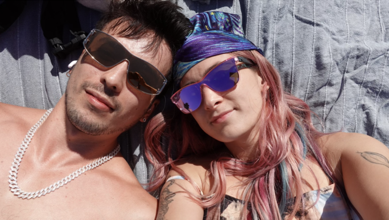 The author and Monica sunbathing at Dolores Park.