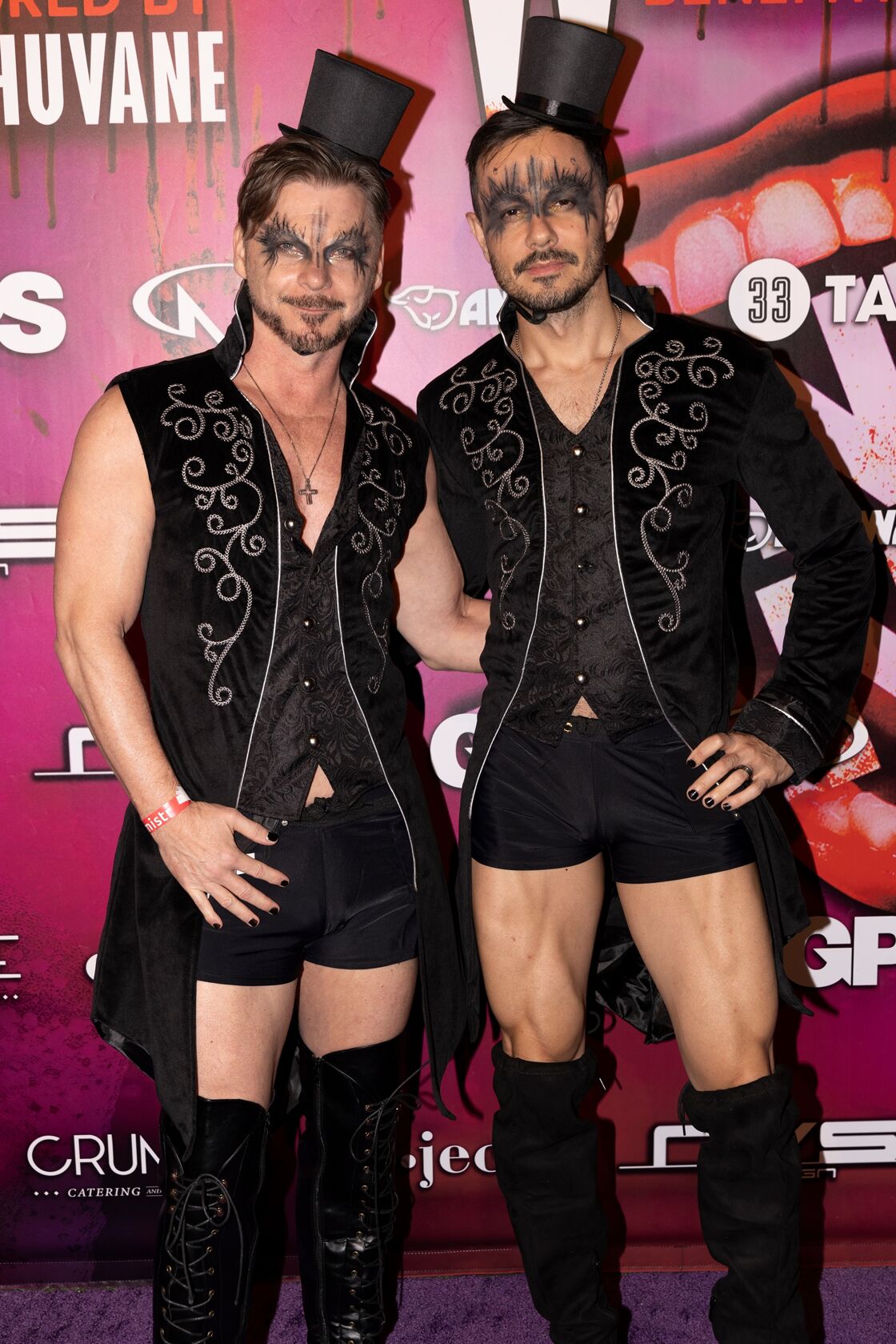 Gay men in black jester hats