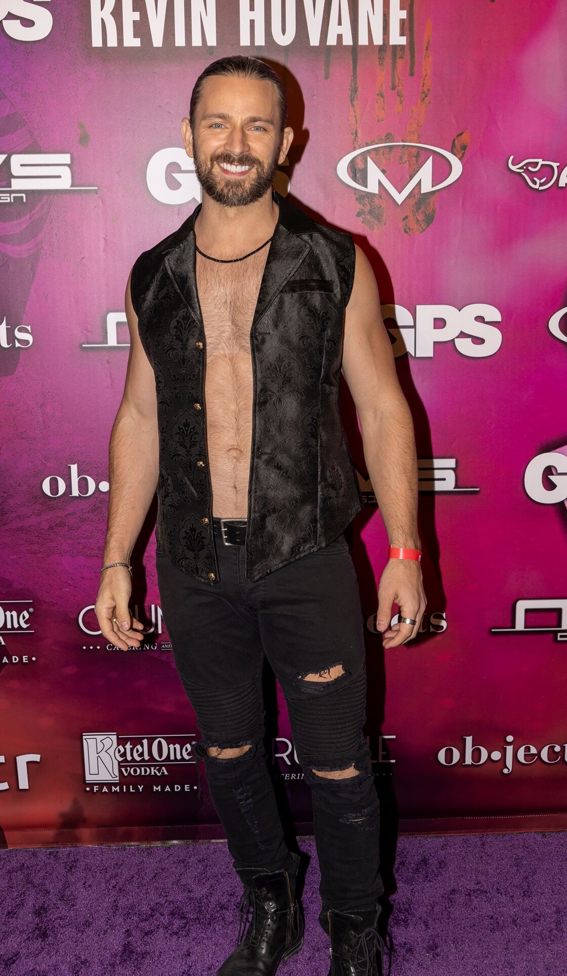 Cute gay man in Black jeans and vest