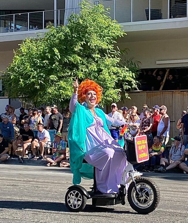Andora on a bike at Palm Springs Pride