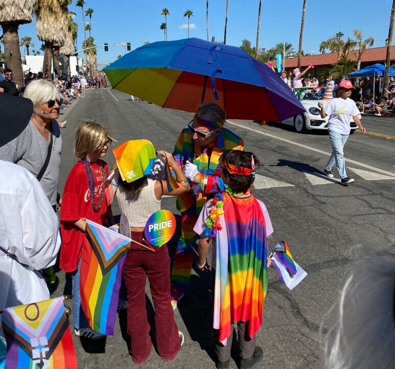 Kids getting rainbow facepaint