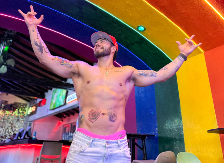 Amaya poses inside a gay bar