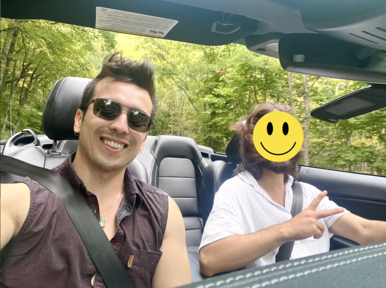 A photo of the author and his brother in a convertible driving through the Blue Ridge Mountains.