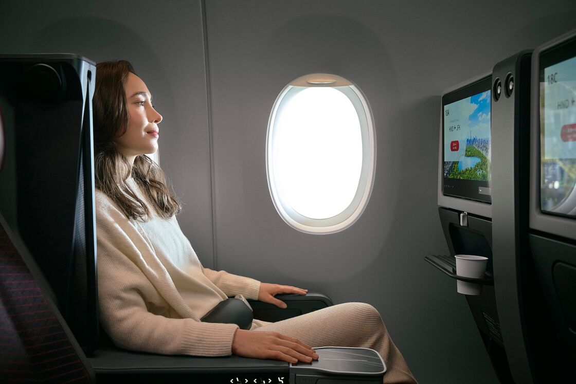 A female passenger in premium economy on Japan Airlines