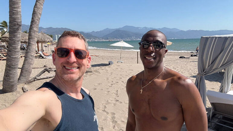 The author and his husband at Tau Beach Club
