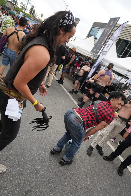 Victor Tang playfully experimenting with mild flogging at Off Sunset 2025