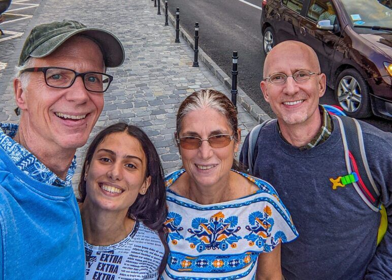 Brent and Michael pose with two Romanian women on the street