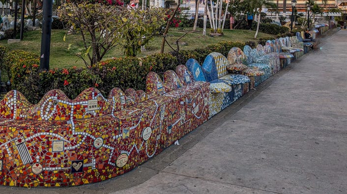 A row of mosaic covered benches