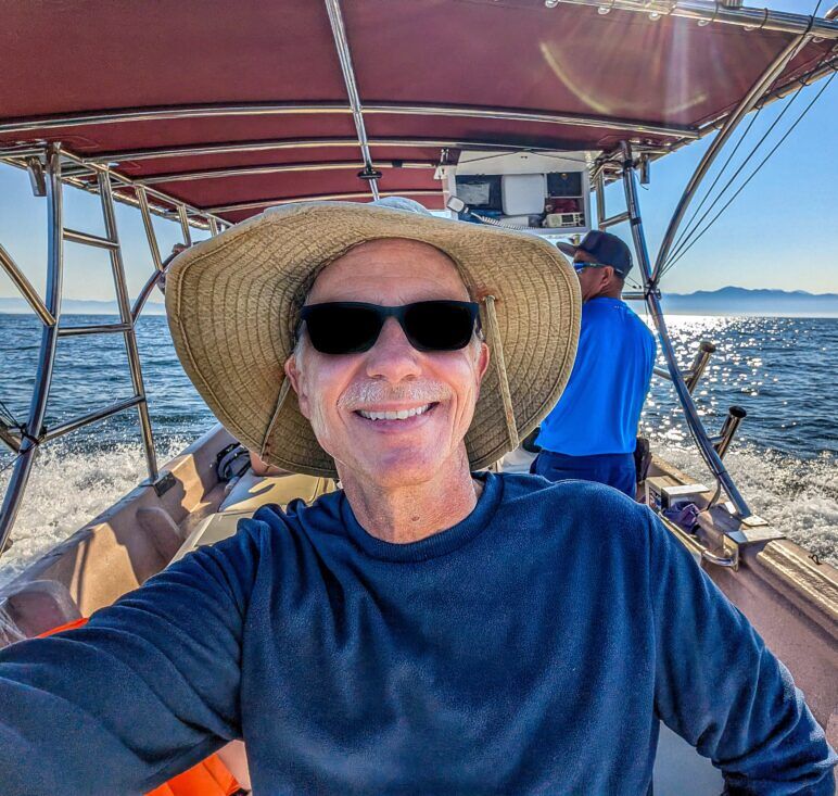 The author poses for a selfie on a boat