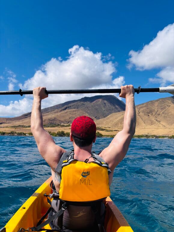 Author lifting is paddle while canooing at sea 