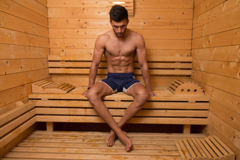 Happy Good Looking And Attractive Young Man With Muscular Body Relaxing In Sauna Hot