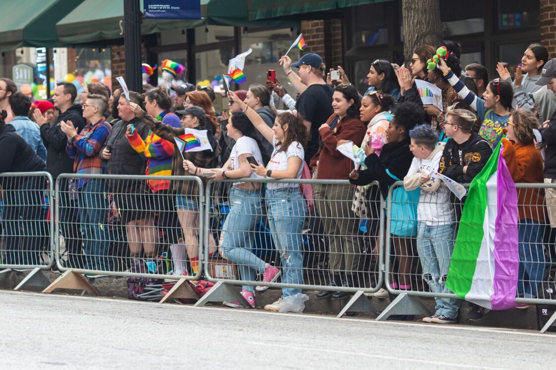 Queer women on the sidelines of the the Atlanta Pride march.