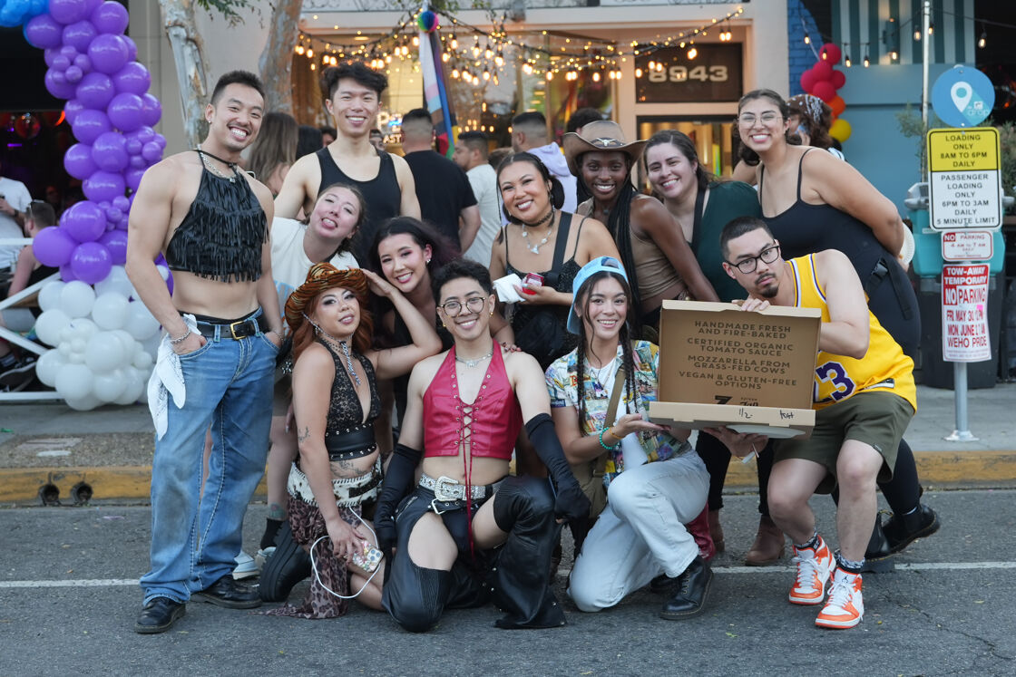 group of people in front of z pizza