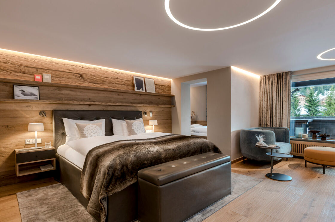 A stylish room with a view of the Alps