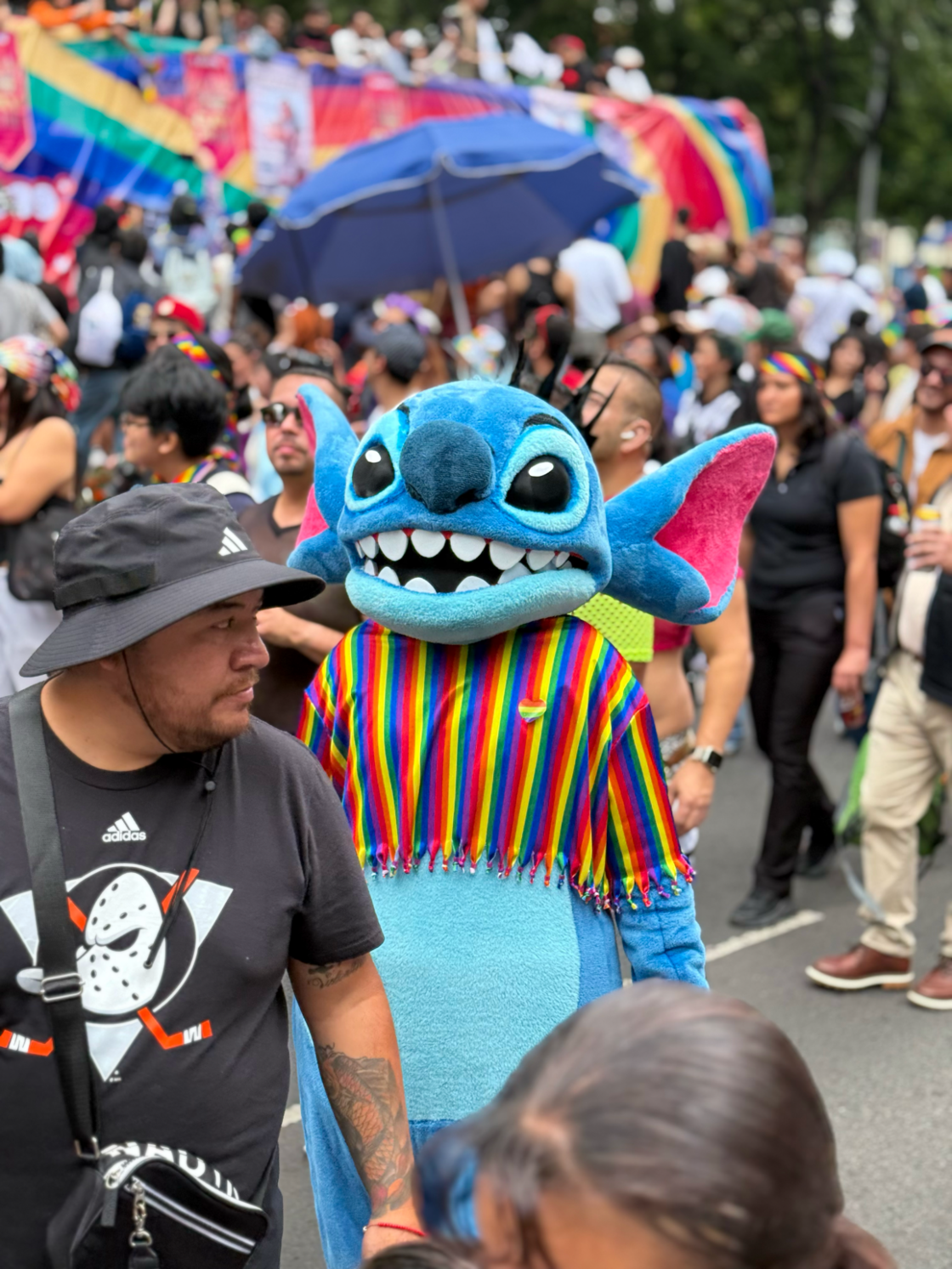 A person wears a Stitch costume at Mexico City Pride.