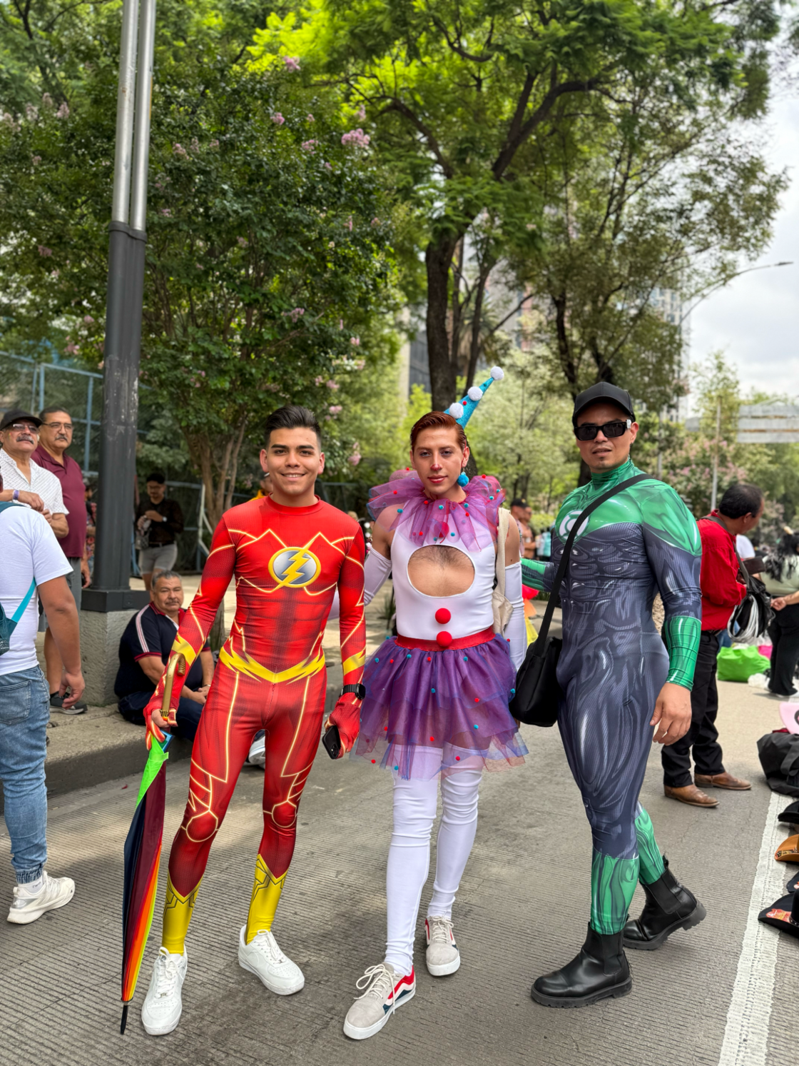 Three men pose on the streets of Mexico City at Pride.