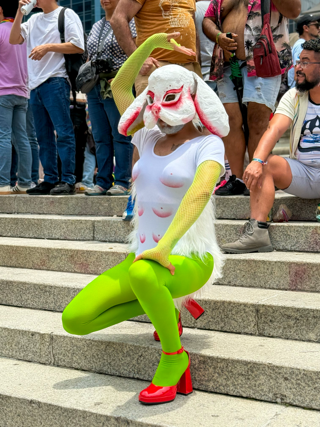 A Mexico City Pride attendee wears a rabbit mask and fishnet stockings.