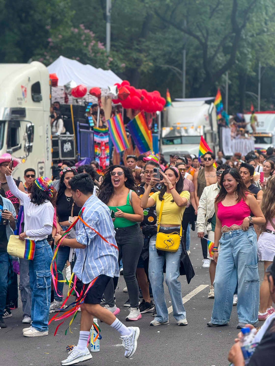 Mexico City Pride attendees dance down the street following the parade.