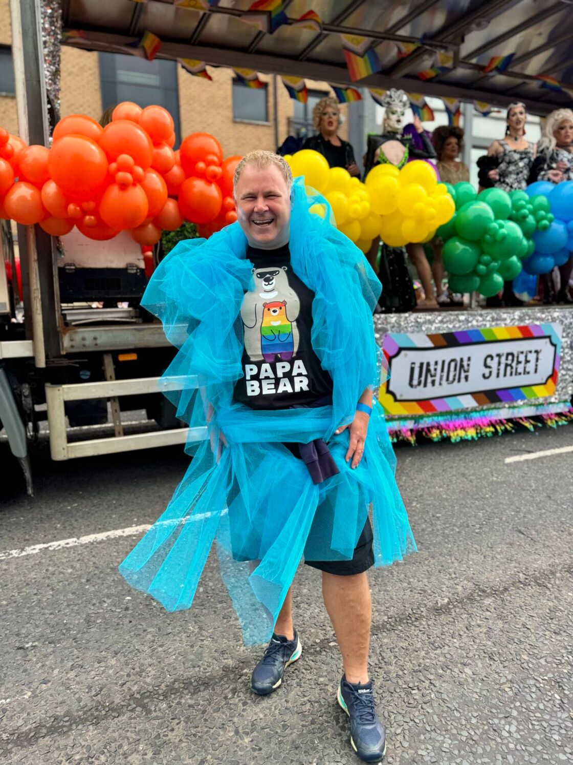 Gay bear in taffeta smiles in Belfast
