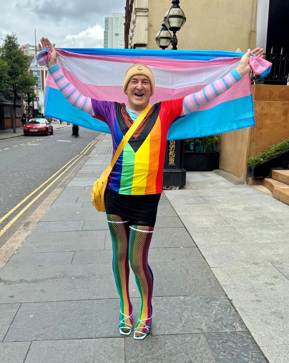 Belfast parade man with every type of LGBTQ+ flag