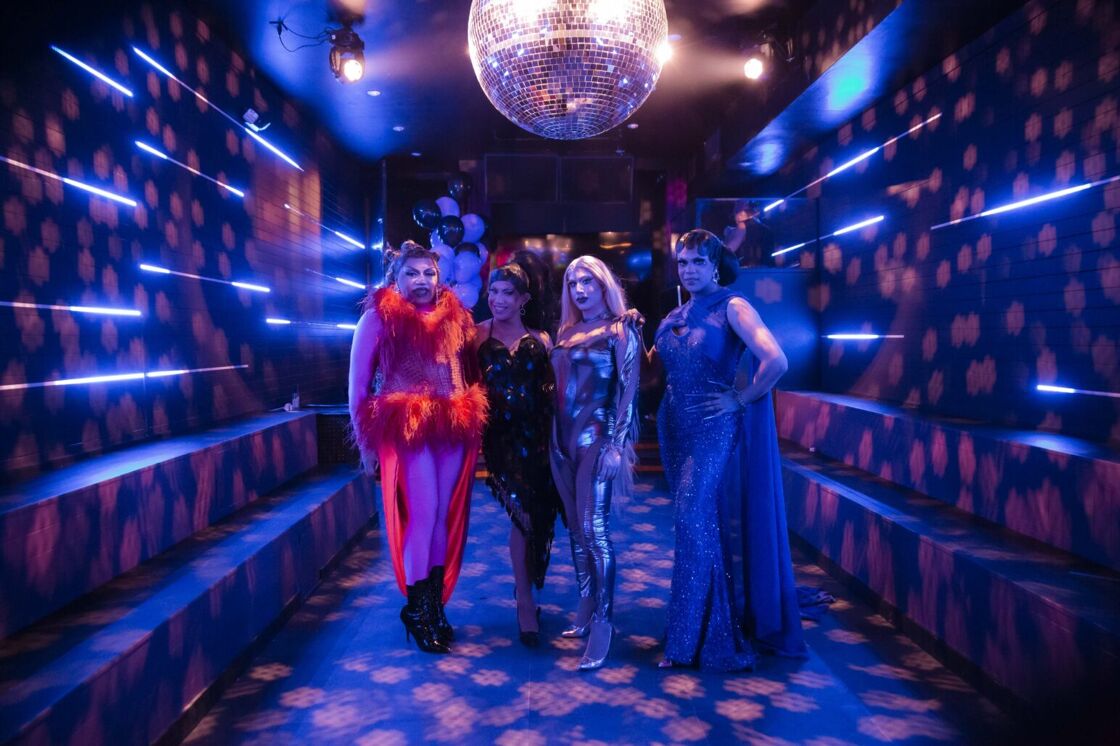 Drag queens Lanyé Armön, Stasi, Boy Gorge, Queenlee Stars stand in a line on the dance floor at The Ritz Bar & Lounge.