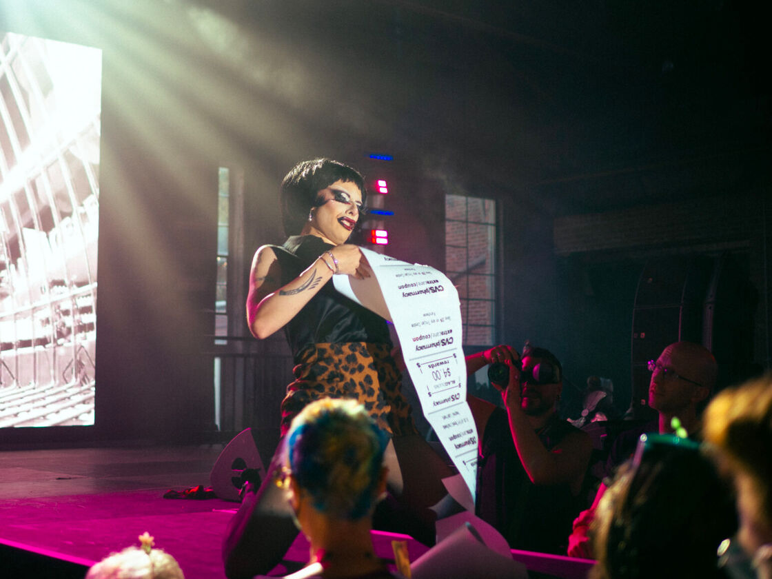 A drag queen performs with a giant CVS receipts prop at Bushwig. 