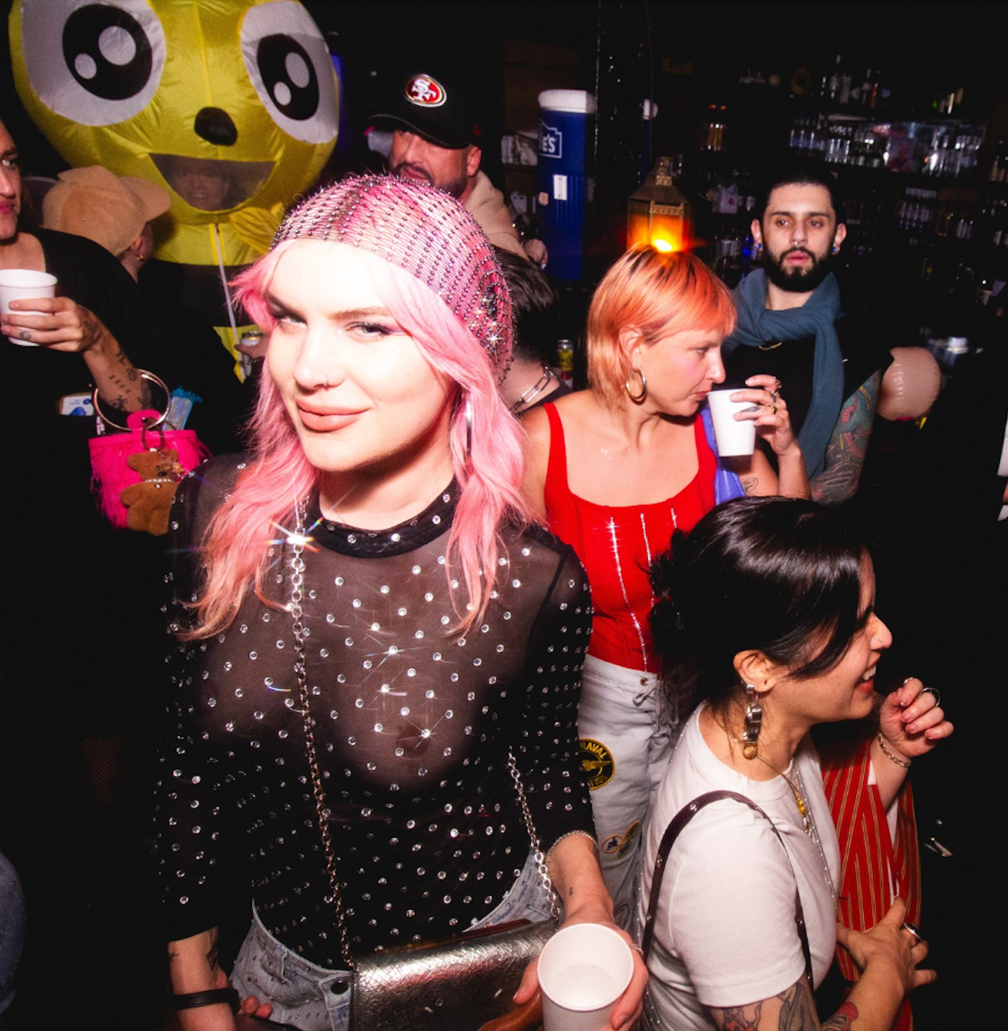 Dancers pose happily at a themed night at The Stud.