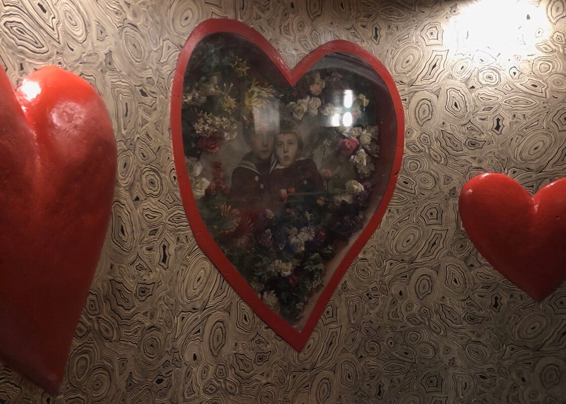 A heart-shaped framed picture on the wall at Hafen.