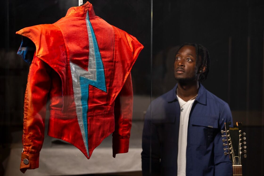 A visitor looks at the Aladdin Sane jacket
designed by Freddie Burretti for David Bowie
on the Ziggy Stardust live tour in 1973 on
display in the David Bowie Centre.