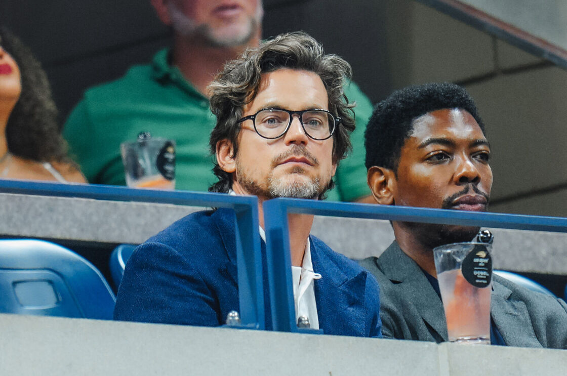 Matt Bomer intently watches the game at the US Open.