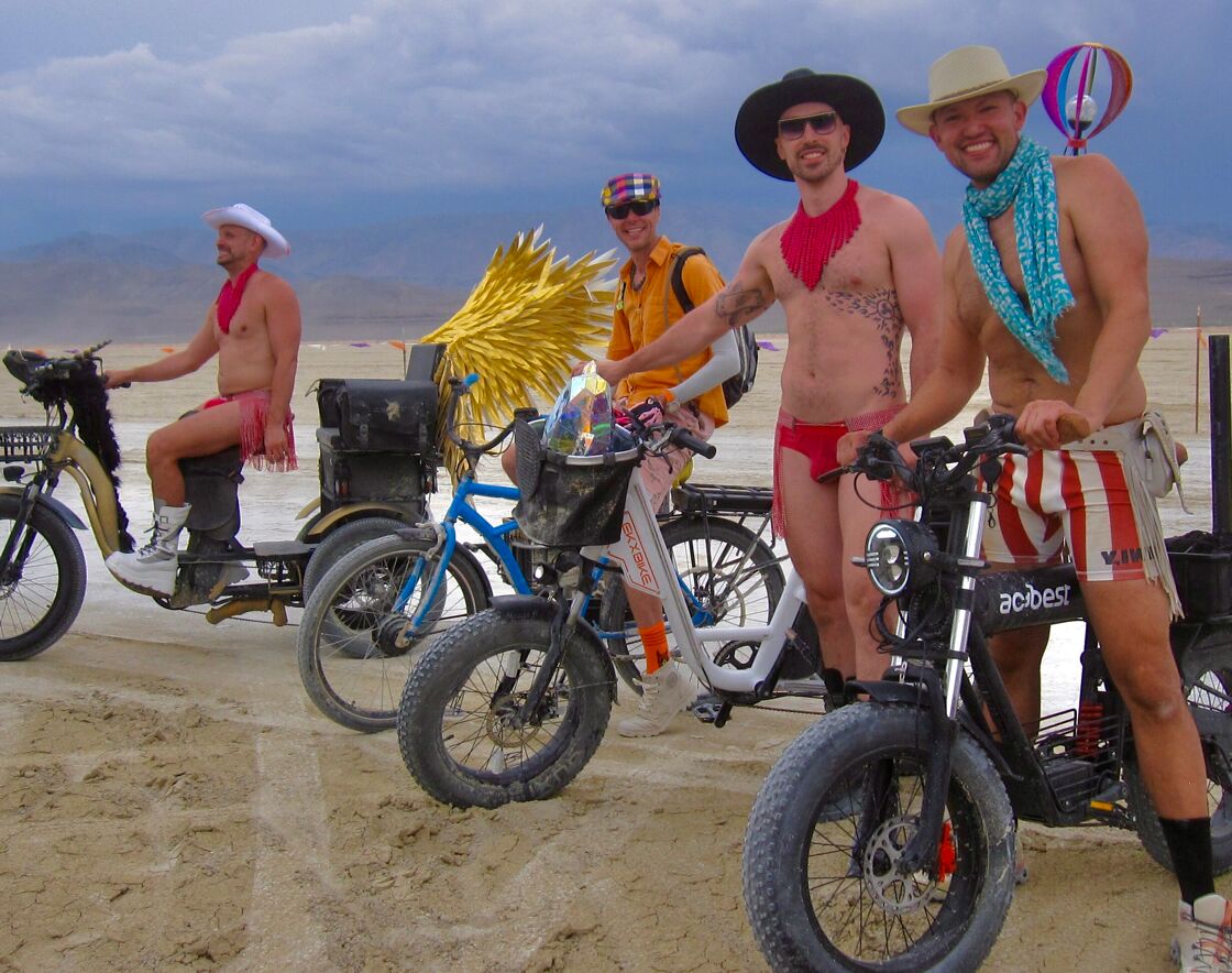 Headed out onto the Burning Man Playa on bikes after the rain.