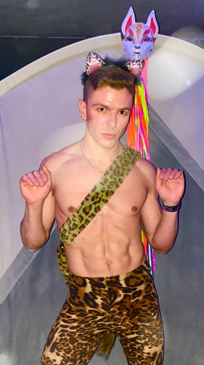 Vancuover-based Glamcock Nikolai flaunting his post-apocalyptic pussycat ensemble at the 2022 Animalia Burn.