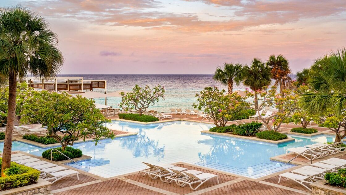 One of the pools facing the ocean at the Curaçao Marriott Beach Resort, pictured at sunset.