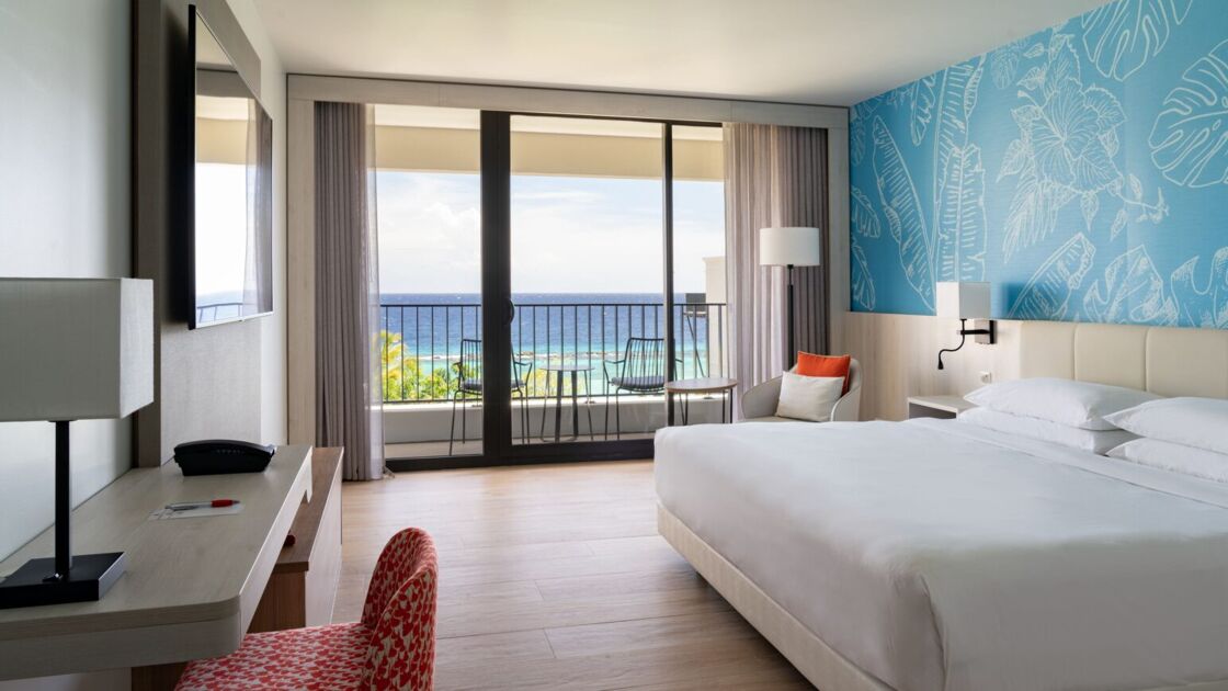 A king suite with an ocean view at the Curaçao Marriott Beach Resort.