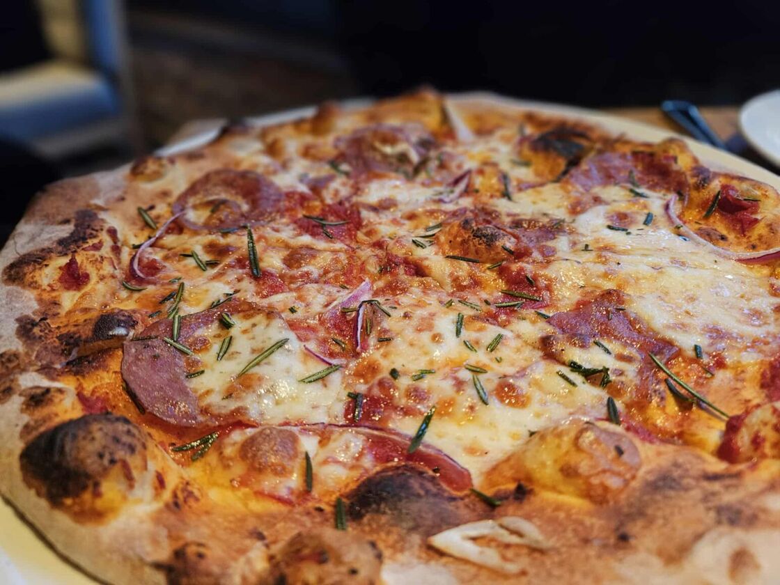 An appetizing personal pizza plated at Tre Rivali in Milwaukee.