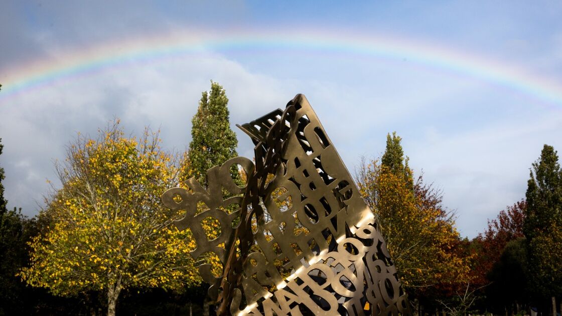 A rainbow emerges over the LGBT+ Armed Forces Community Memorial 