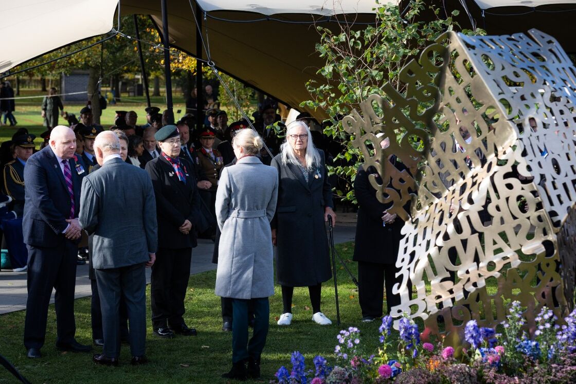 King Charles talks to veterans at yesterday's memorial unveiling 