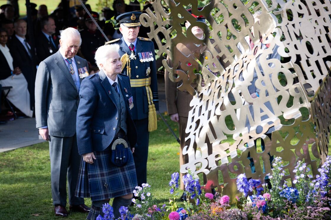 King Charles III (left) attends yesterday's unveiling of the memorial