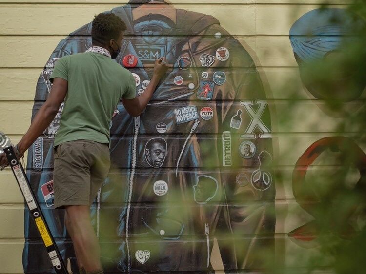 Serge Gay Jr painting outside Moby Dick in San Francisco