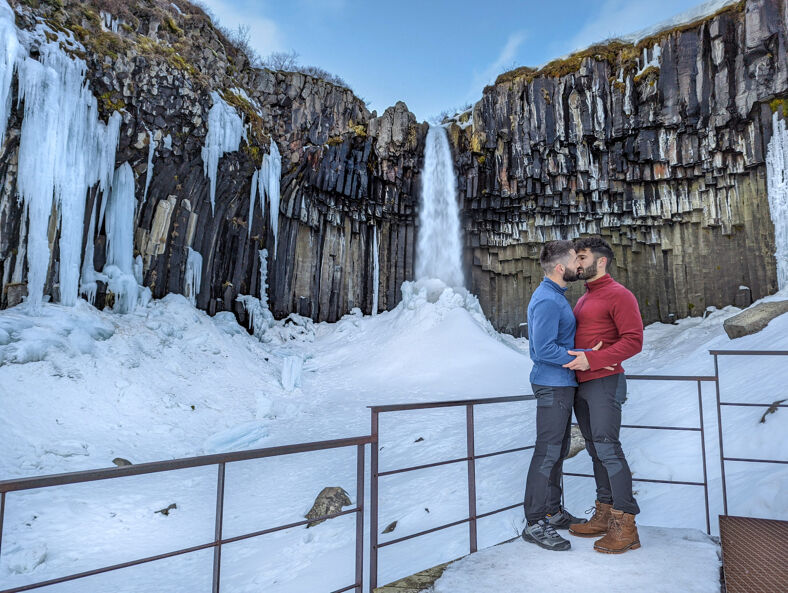 Nomadic Boys gay couple at Svartifoss waterfall