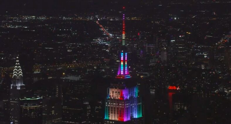 The Empire State Building in New York City is lit with rainbow colors to mark Pride Month