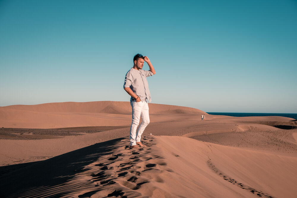 A man on a sand dune