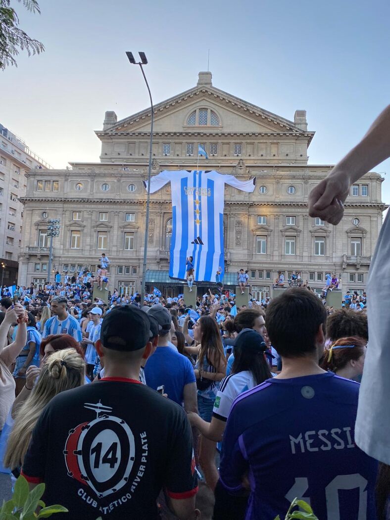 a larger than life Argentina jersey hung on the facade of City Hall in Buenos Aires.